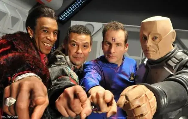 Meme chế khuôn mặt nghiêng người, ngón tay trỏ hướng về đối phương.