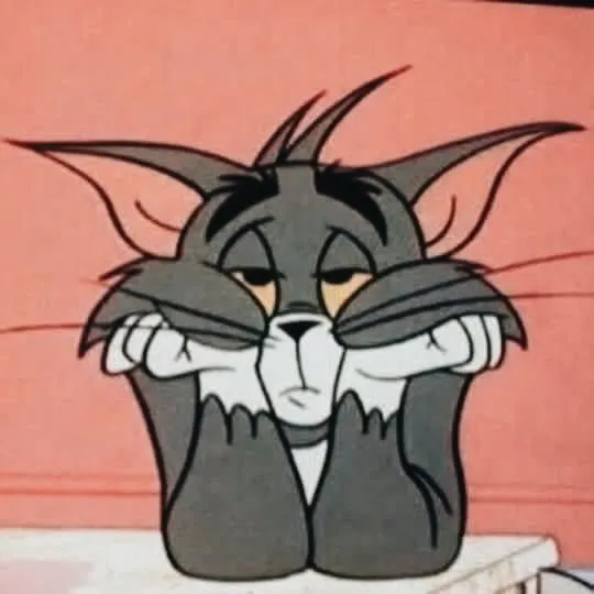 Mèo Tom chống cằm buồn bã