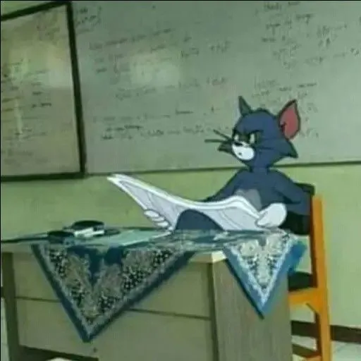 Mèo Tom ngồi đọc báo