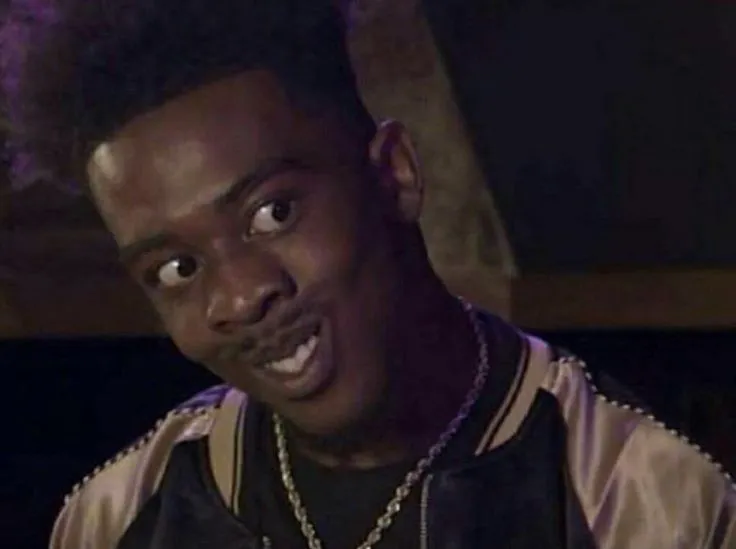 Meme anh da đen cười toe toét khi ai đó thua mà vẫn cười “ok”.