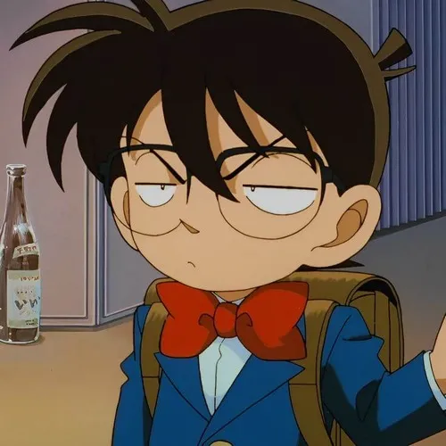 Hình meme hài Conan nhướng mày khi Ran gọi tên Shinichi