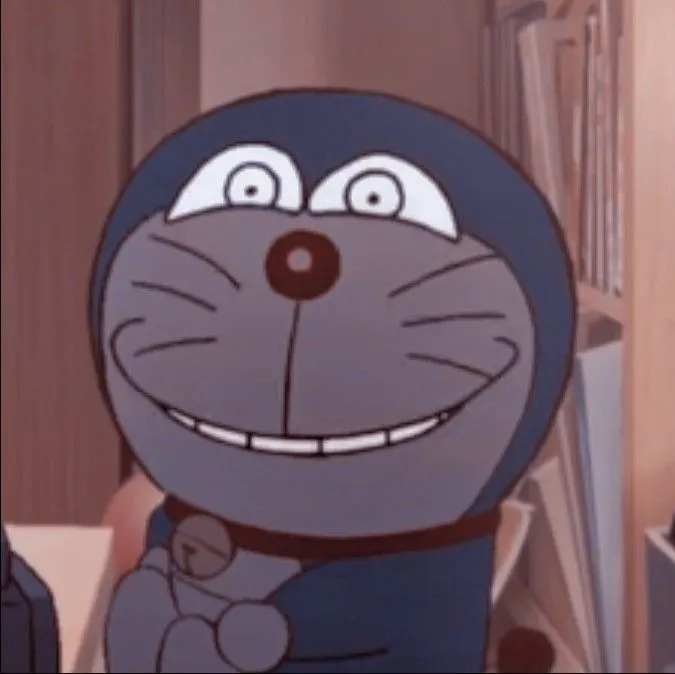 Hình chế meme vui Doraemon nhún vai khi bị Nobita đổ lỗi